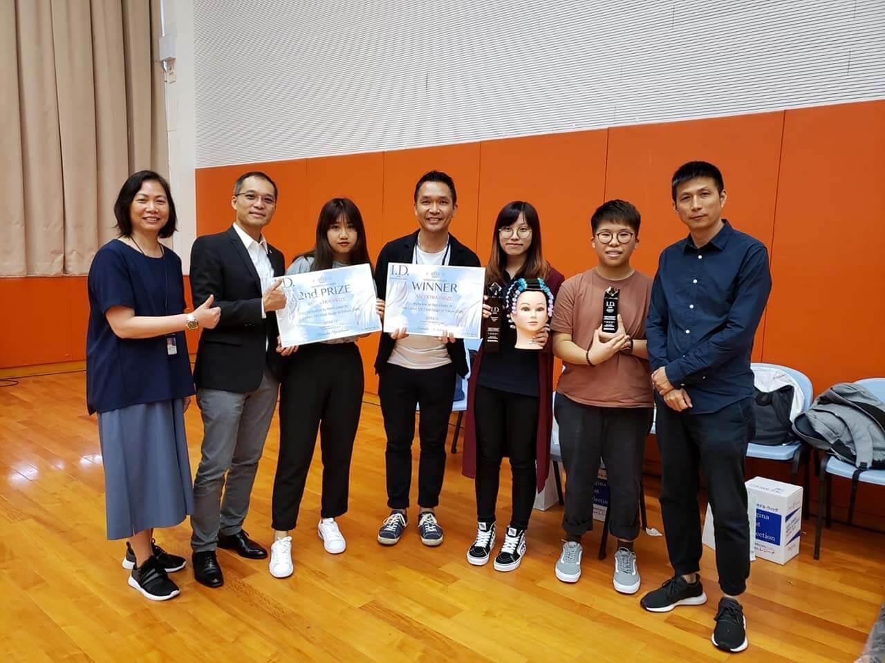 A group photo of the award-winning students and the teacher